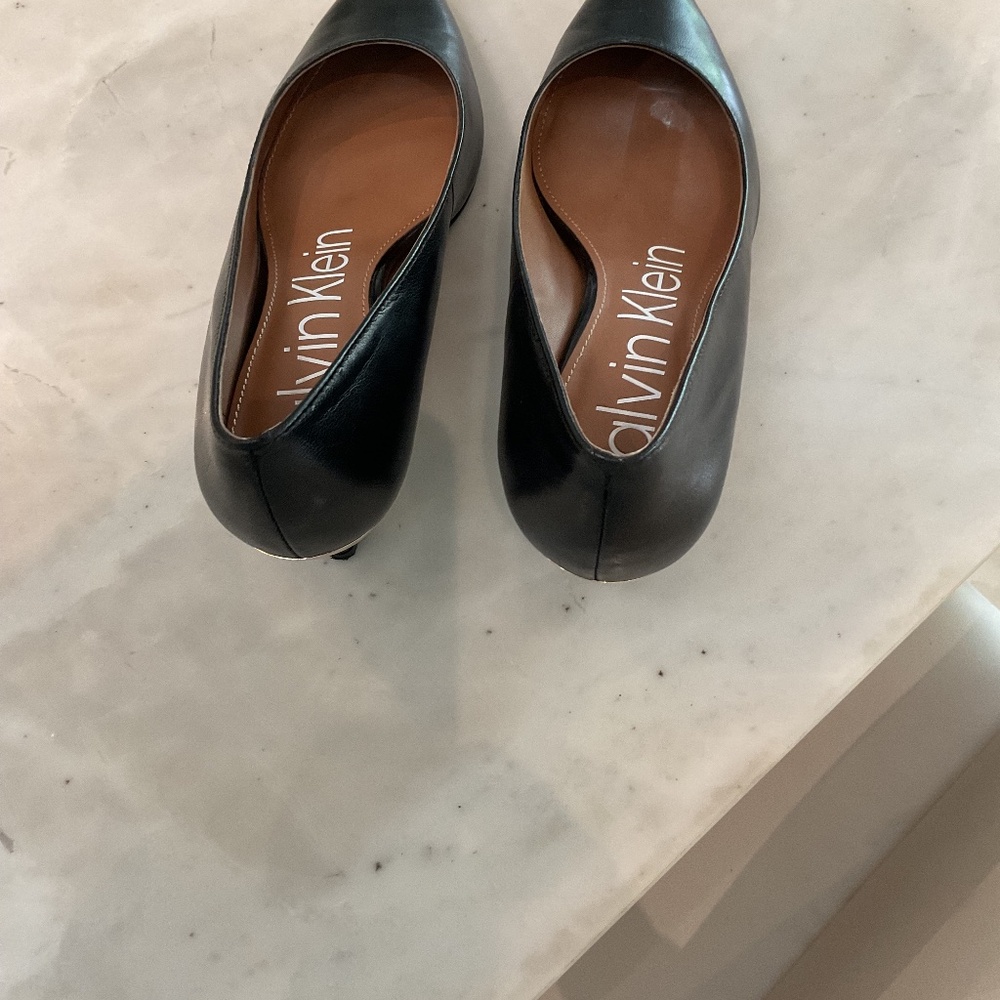 Calvin Klein kitten heels never worn.  Black leather kitten heels